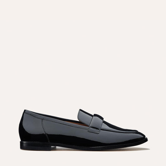 Margaux's structured Andie Loafer, made in a shiny, black Italian patent leather with a plush, padded keeper