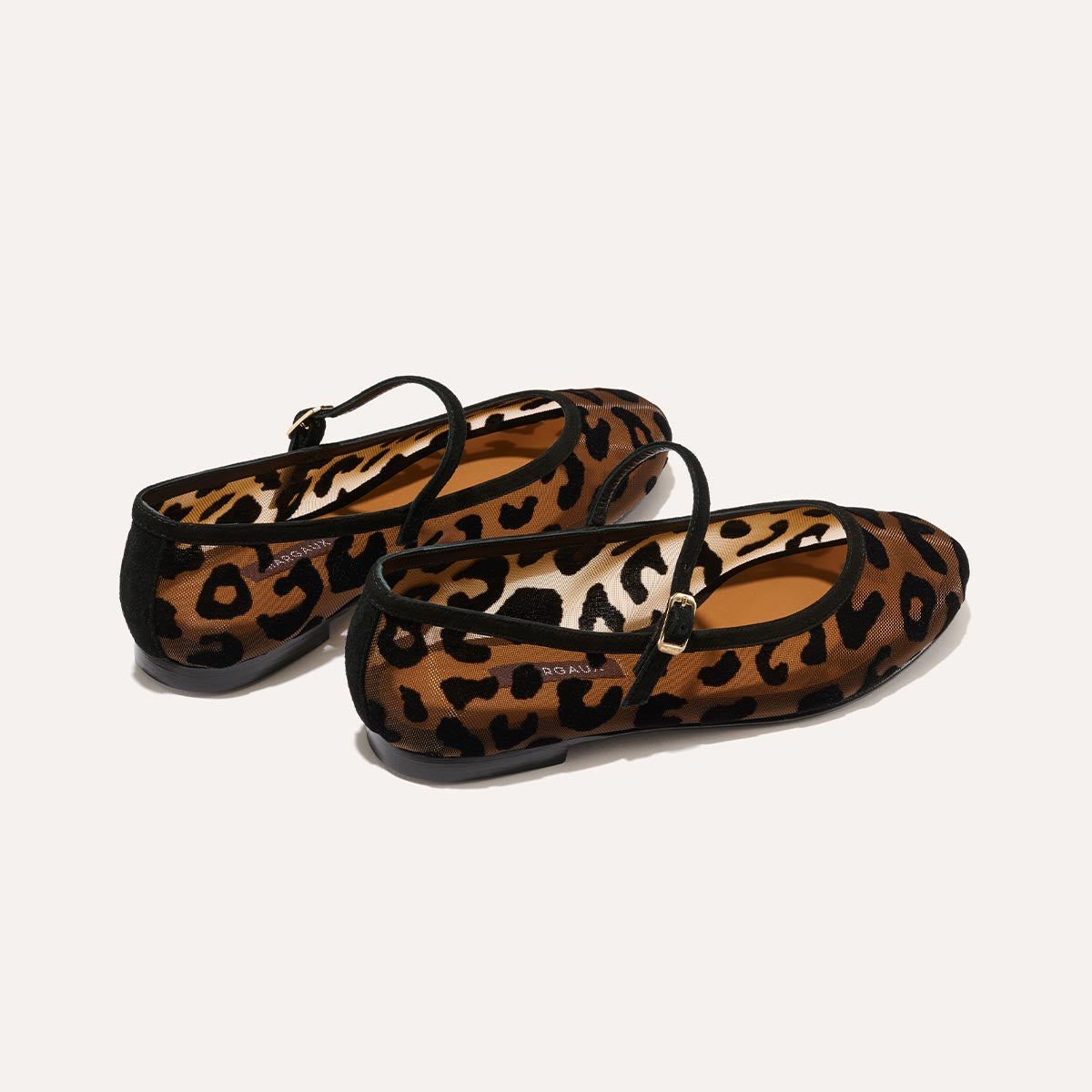 The Demi Jane in Leopard Mesh, a ballet flat with a rounded toe and an adjustable strap for a secure fit.