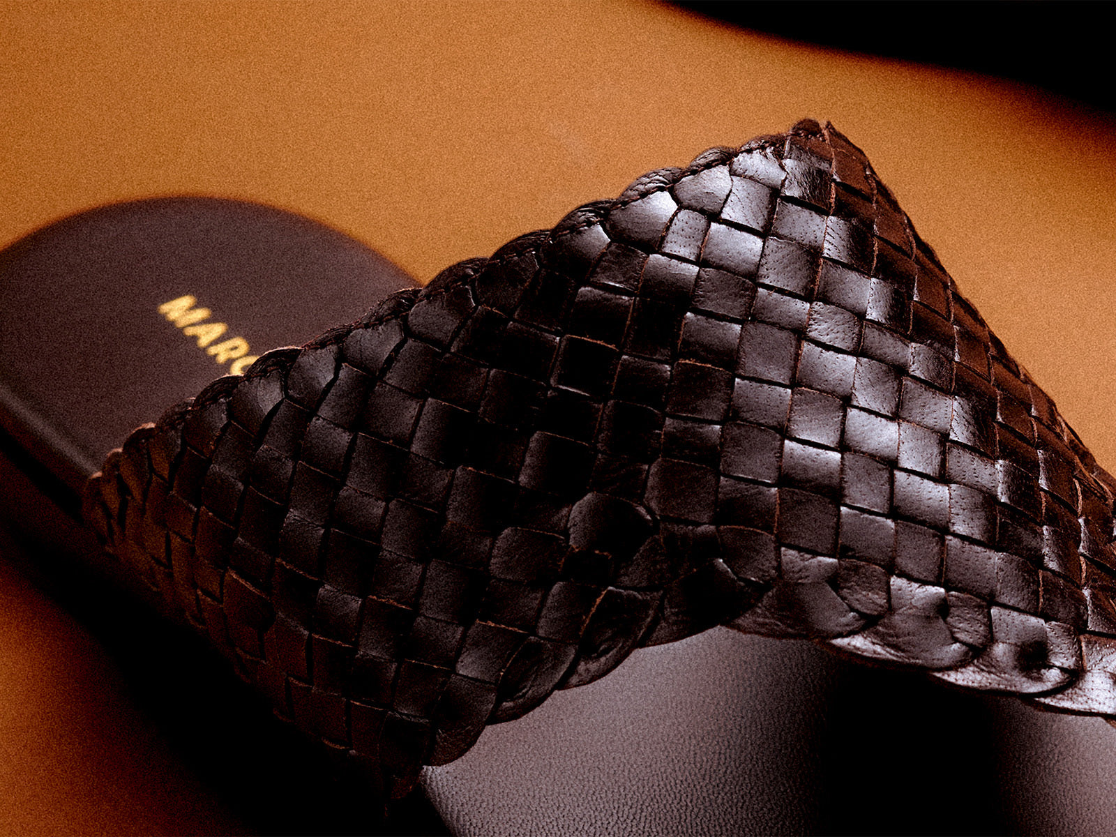 Close up of woven brown sandals