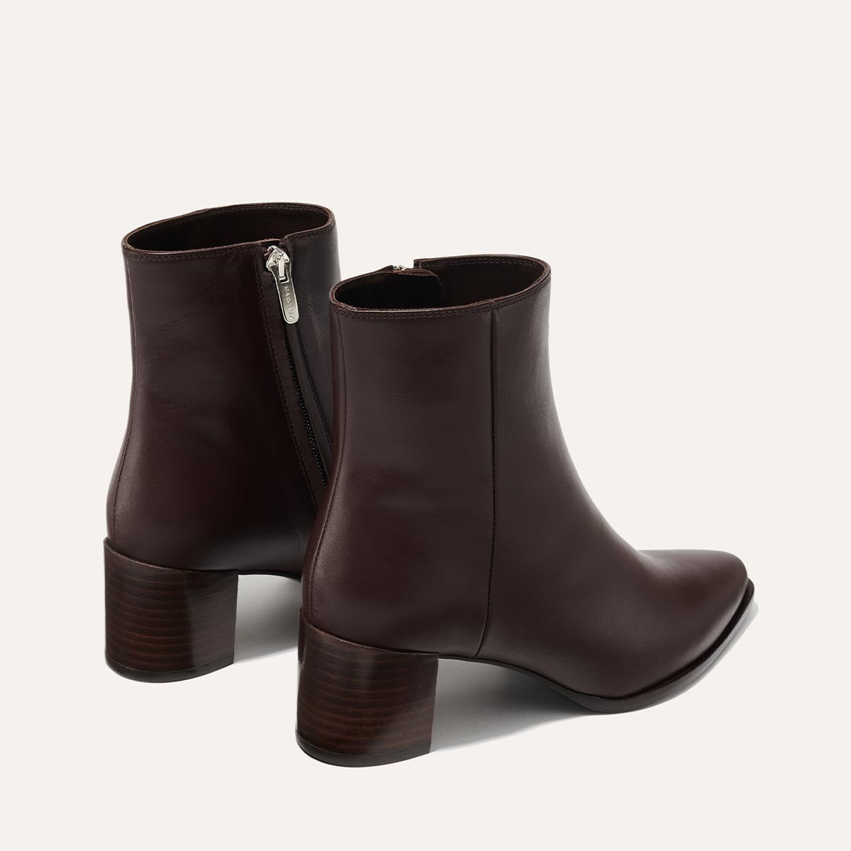 The Downtown Boot in Espresso Calf, a chic ankle-height design complete with a Western-inspired welt and a comfortable 2.5-inch stacked heel.