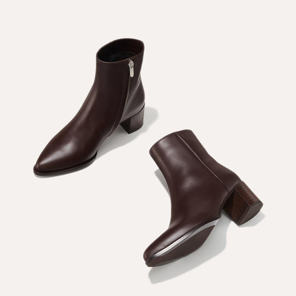 The Downtown Boot in Espresso Calf, a chic ankle-height design complete with a Western-inspired welt and a comfortable 2.5-inch stacked heel.