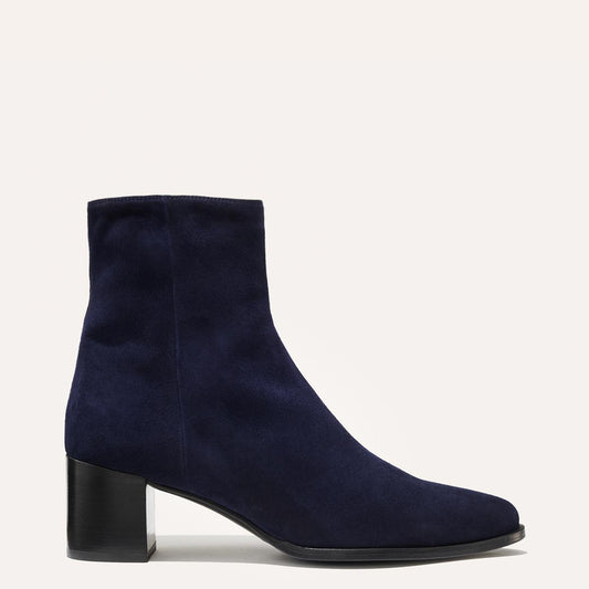Margaux's classic Downtown Boot in navy blue suede with a comfortable block heel and pointed toe