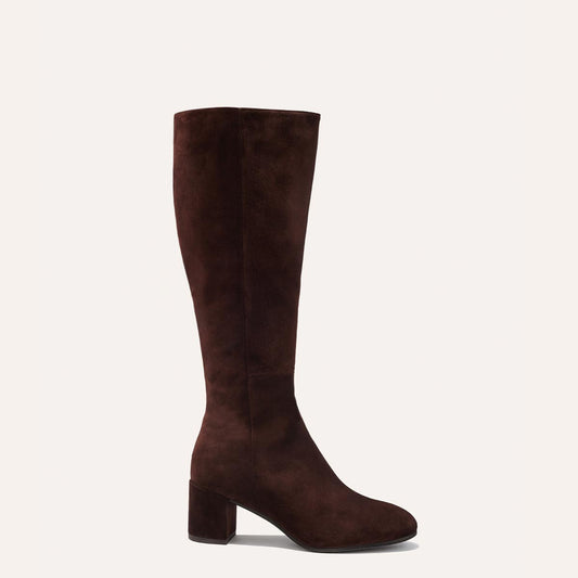 Margaux's knee-grazing Edie Boot in soft, chocolate Italian suede with walkable heel and almond-shaped toe