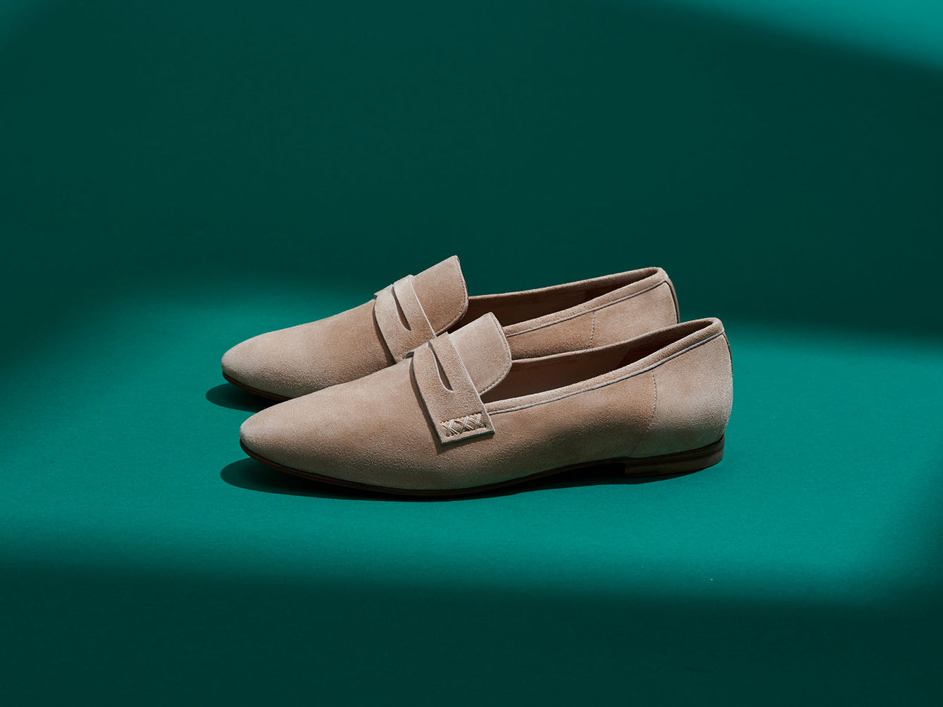 Margaux's Penny loafer in a neutral beige suede