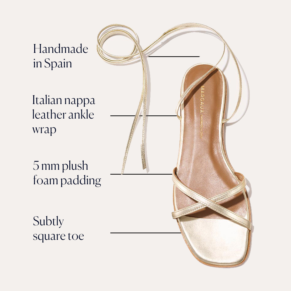 The Wrap Sandal - Champagne Nappa by Margaux features Italian nappa leather ankle wrap, gold finish, subtly square toe, 5mm foam padding, and a handmade in Spain label—highlighted lines elevate this sandal’s sophisticated summertime versatility.