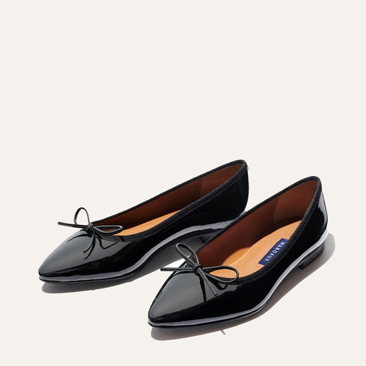 Margaux's classic and comfortable pointed-toe ballet flat, made in a shiny, black Italian patent leather