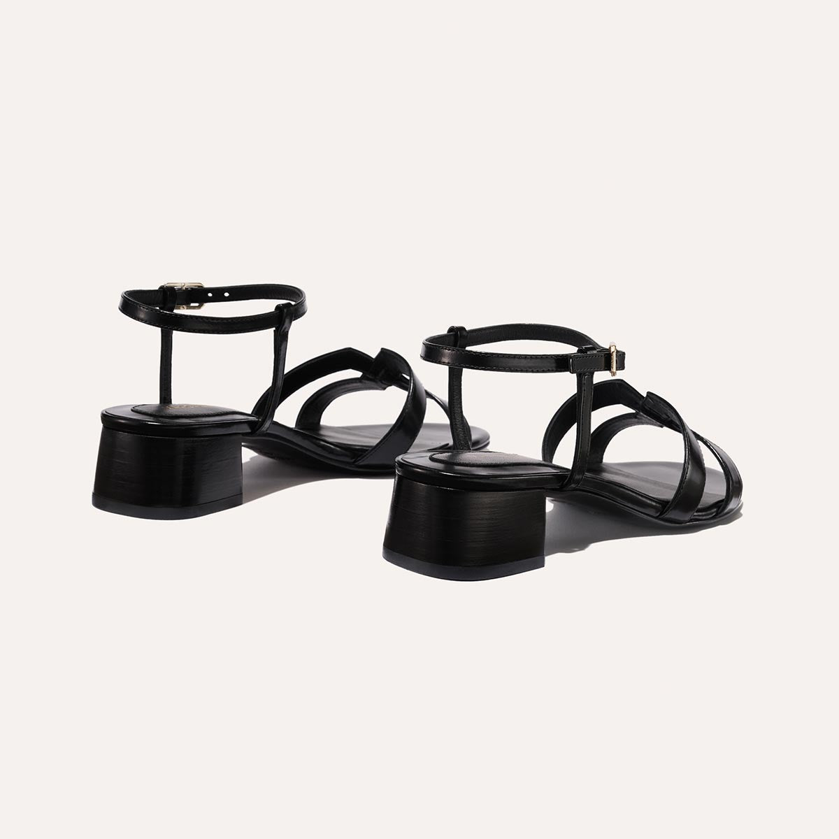 Low heeled sandals shown in black leather