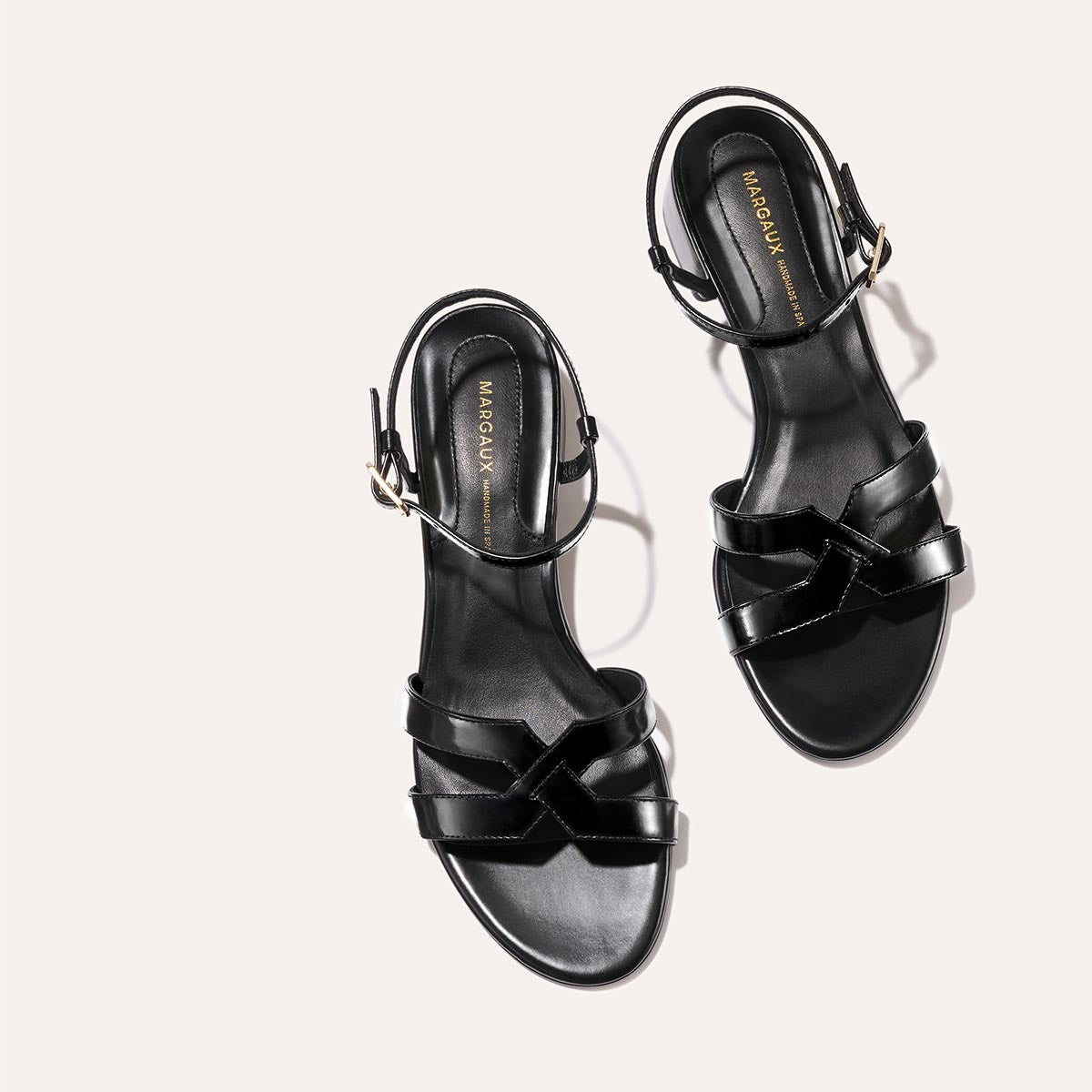 Low heeled sandals shown in black leather