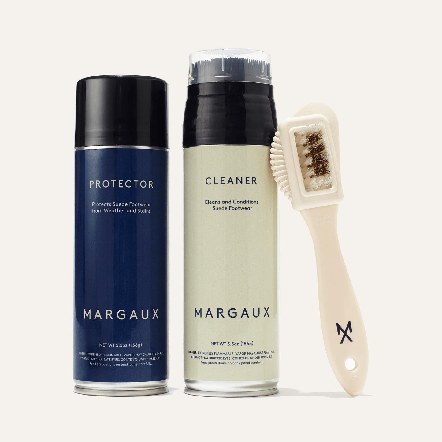 The Suede Care Kit from margaux-development includes Cleaner and Protector sprays plus a white Margaux M logo brush—everything you need to clean and protect your favorite suede footwear.