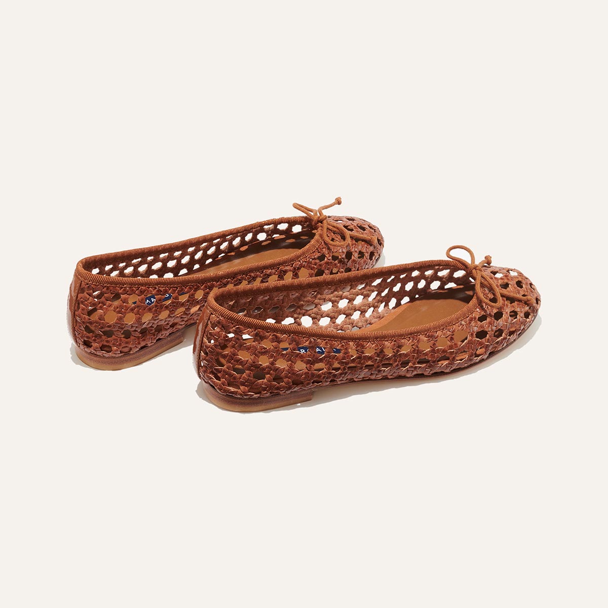 Margaux's classic and comfortable Demi ballet flat, handwoven in India from soft saddle brown leather and finished in Spain