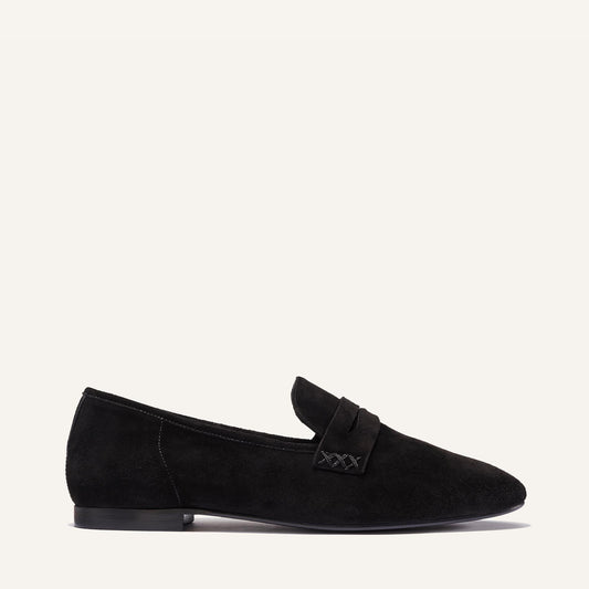 Margaux's classic and comfortable Penny loafer, made in a soft, black Italian suede