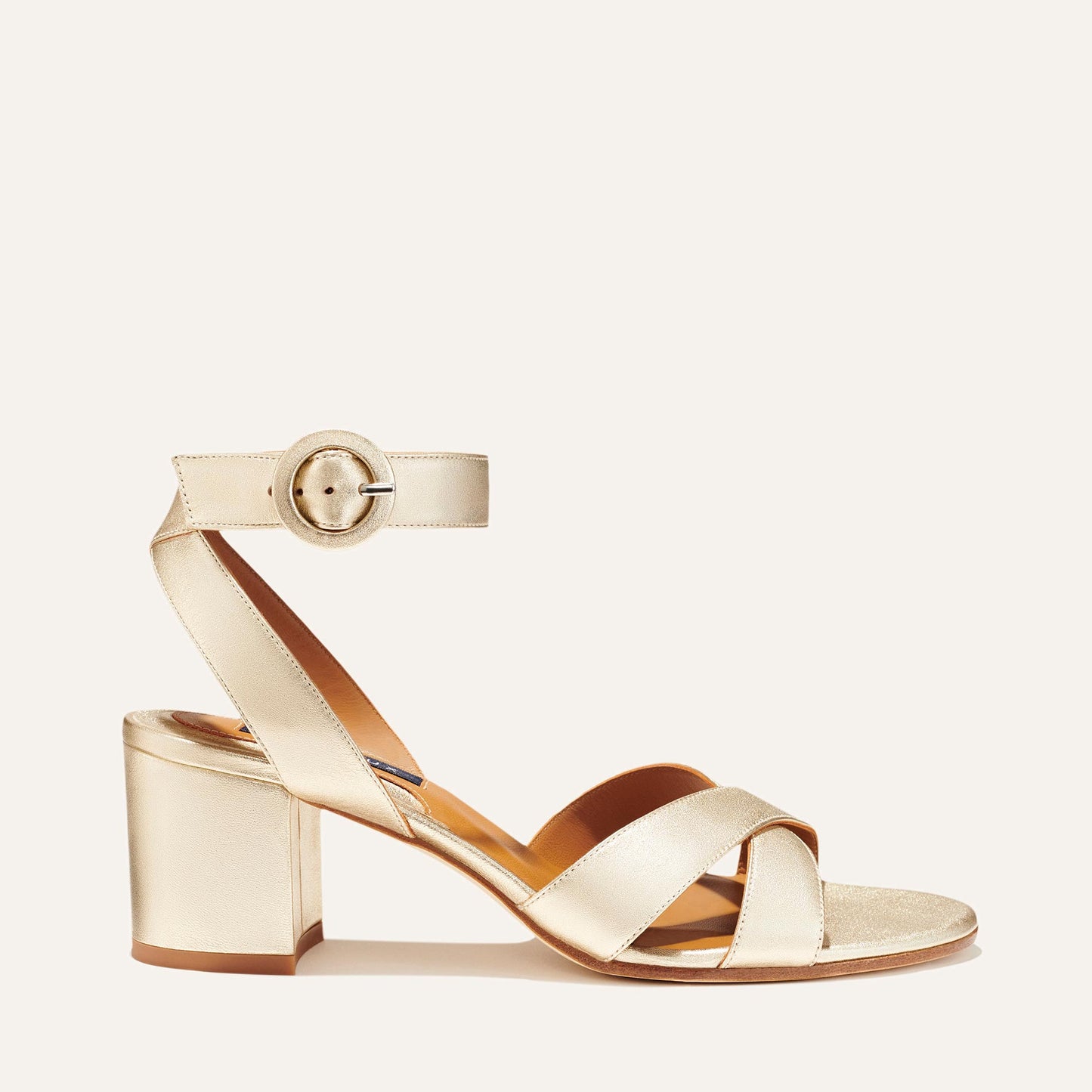 Margaux's classic City Sandal in metallic champagne nappa leather with comfortable straps and a walkable block heel