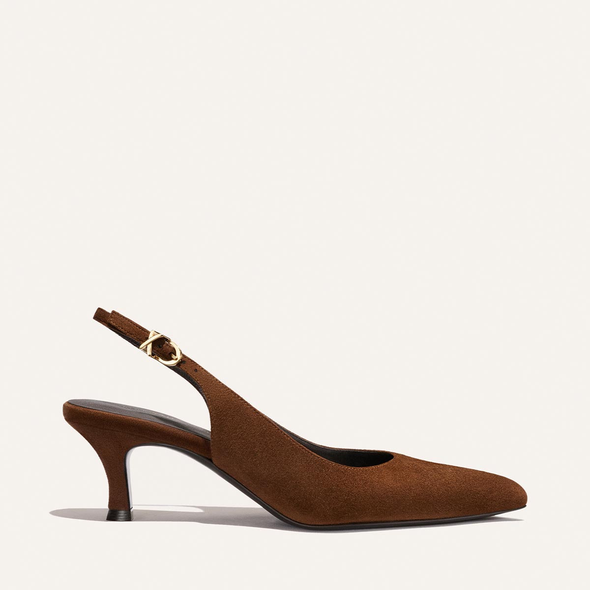 The Colette - Ganache Suede by Margaux is a brown suede slingback heel featuring a snip-nose pointed toe and a small buckle on the strap, displayed against a plain light background.