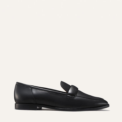The Andie Loafer in Black Nappa, featuring a sleek structured design made from smooth Italian nappa leather with a minimalistic padded keeper detail.