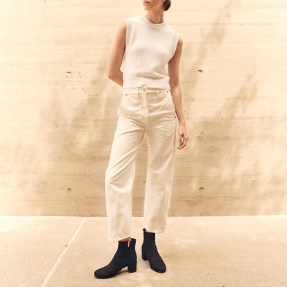 The Boot in Black Suede, featuring an elegant almond toe and block heel, crafted from high-quality Italian leather for a timeless and modern look.