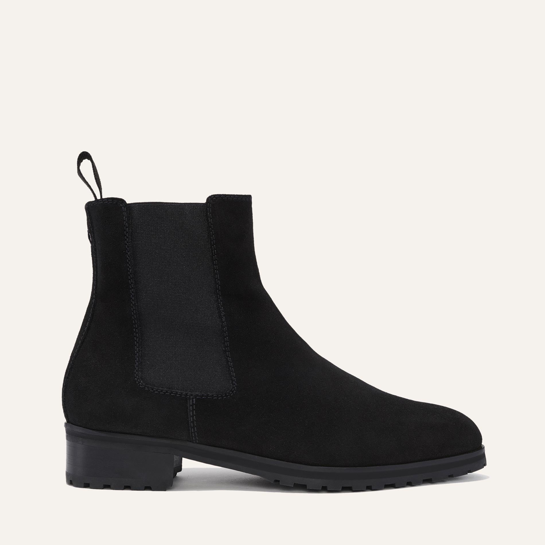 Margaux's classic Chelsea Boot in weatherproof, black German suede with a rubber lug sole and tapered toe