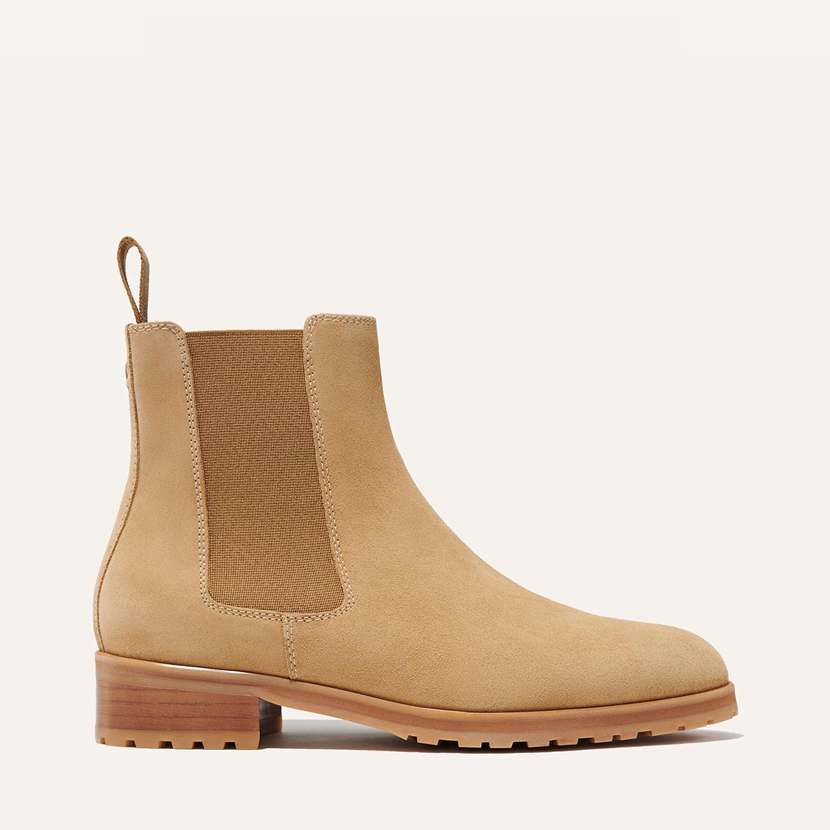 Margaux's classic Chelsea Boot in weatherproof, tan German suede with a rubber lug sole and tapered toe