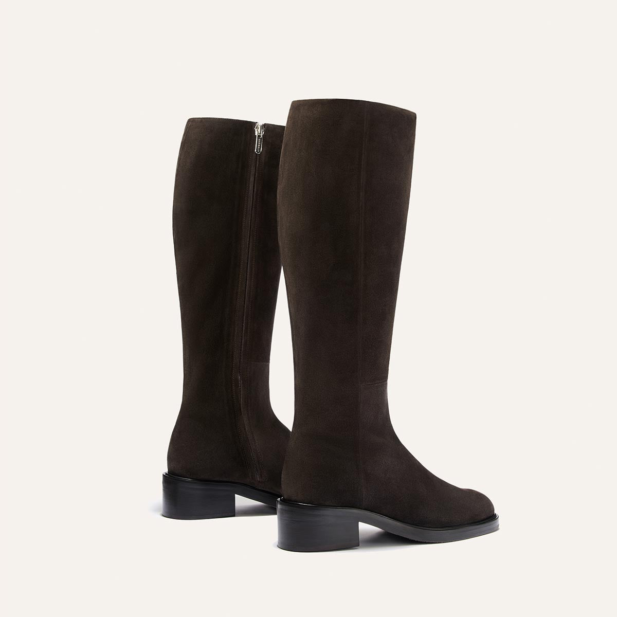 The City Boot - Dark Chocolate Suede: dark brown knee-high suede riding boots featuring a side zipper, a low block heel, and a classic silhouette.