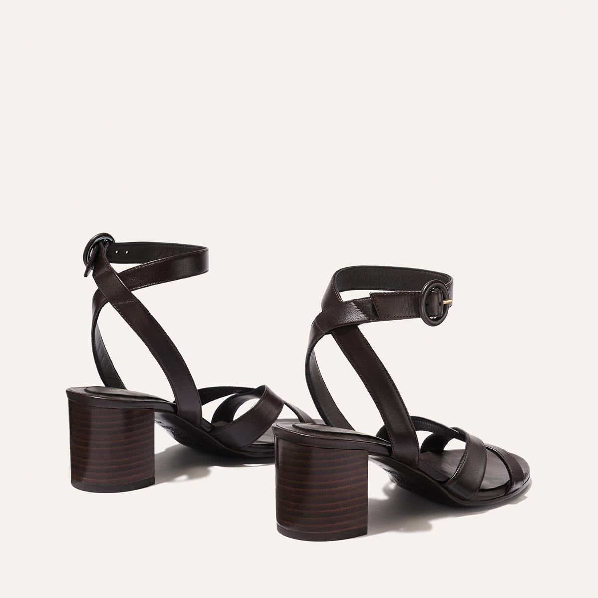 The City Sandal in Espresso Nappa, featuring carefully placed straps, an adjustable ankle strap and a comfortable 2.5-inch block heel.