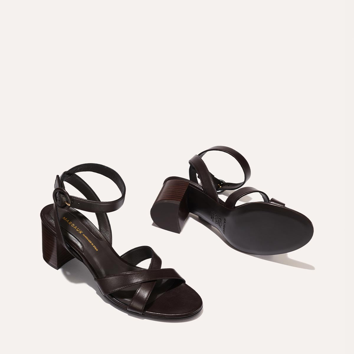 The City Sandal in Espresso Nappa, featuring carefully placed straps, an adjustable ankle strap and a comfortable 2.5-inch block heel.