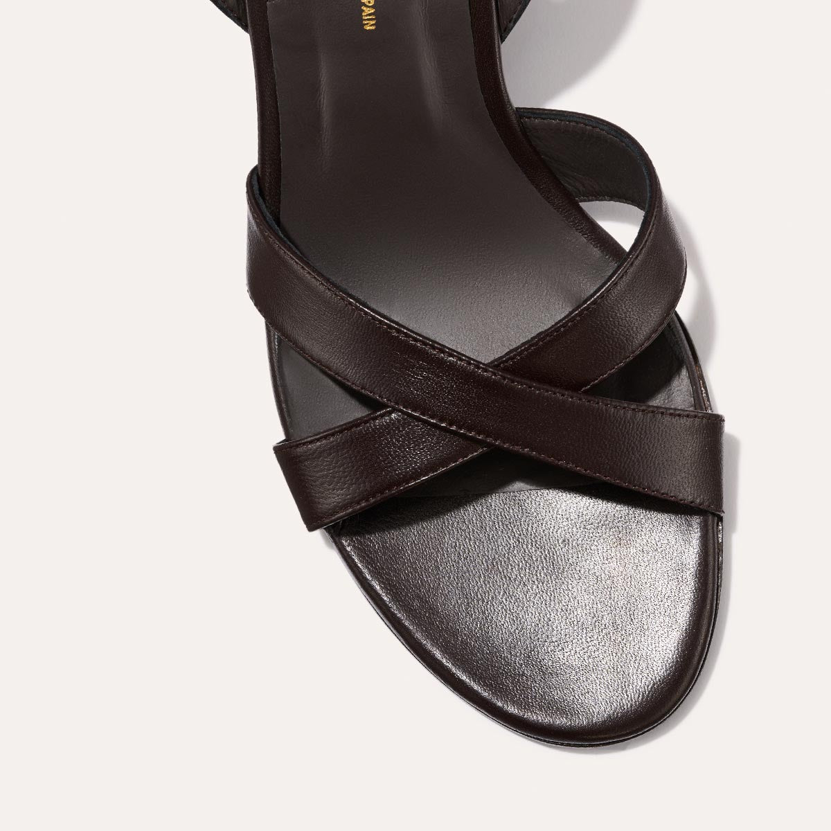 The City Sandal in Espresso Nappa, featuring carefully placed straps, an adjustable ankle strap and a comfortable 2.5-inch block heel.