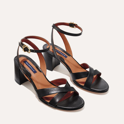 The City Sandal in Black Nappa, featuring carefully placed straps, and adjustable ankle strap and a comfortable 2.5-inch block heel.