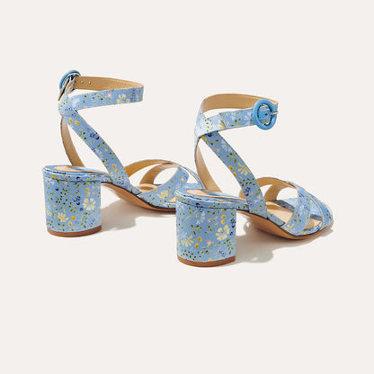 The City Sandal - Blue Floral Satin by margaux-development: light blue open-toe heeled sandals with ankle straps, blue buckles, yellow and green floral print on straps and heels, plus a cushioned insole for comfort.