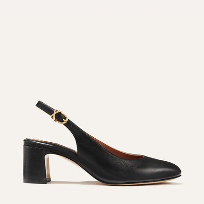 The Cluny Slingback in Black Nappa, featuring a sleek Italian nappa leather upper with an adjustable buckle and a comfortable 2.5-inch black heel.