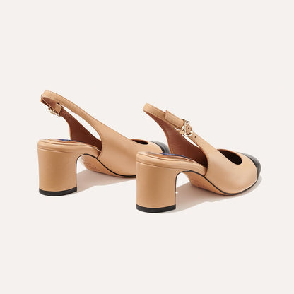 The Cluny Slingback in Dune Nappa, featuring a sleek captoe detail with an adjustable buckle and a comfortable 2.5-inch black heel.