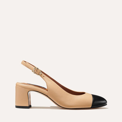 The Cluny Slingback in Dune Nappa, featuring a sleek captoe detail with an adjustable buckle and a comfortable 2.5-inch black heel.