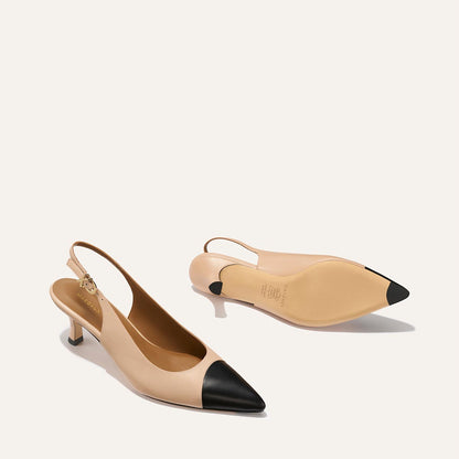 The Colette by Margaux: Dune and Black Nappa slingback shoes featuring a pointed snip toe and a subtle micro heel.