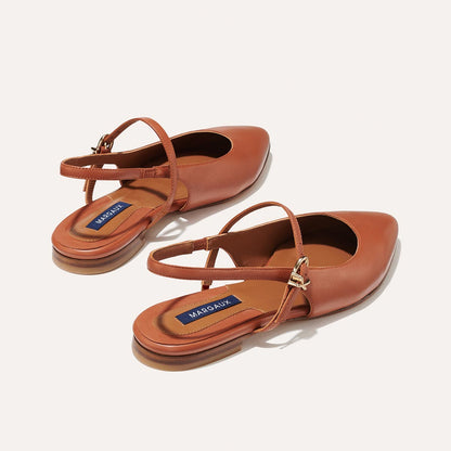 The Cluny Slingback in Saddle Nappa, a ballet flat with a pointed toe, a slingback strap and an adjustable strap across the top of the foot for a secure fit.