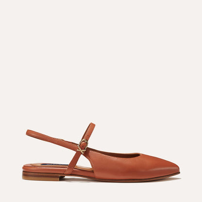 The Cluny Slingback in Saddle Nappa, a ballet flat with a pointed toe, a slingback strap and an adjustable strap across the top of the foot for a secure fit.