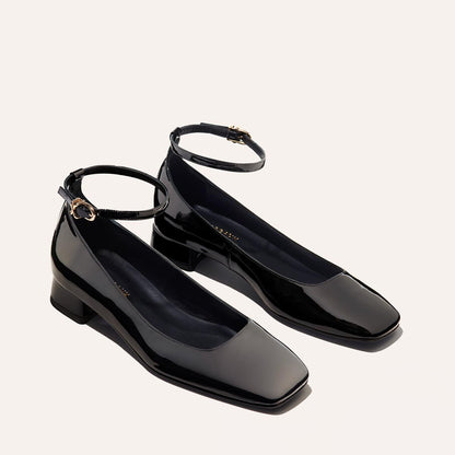 The Daphne in Black Patent, featuring a chic square toe, a supportive ankle strap and a versatile 1-inch block heel,