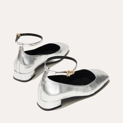 The Daphne in shiny Silver Crinkle Mirror, featuring a chic square toe, a supportive ankle strap and a versatile 1-inch block heel,