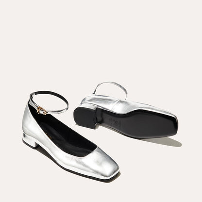 The Daphne in shiny Silver Crinkle Mirror, featuring a chic square toe, a supportive ankle strap and a versatile 1-inch block heel,