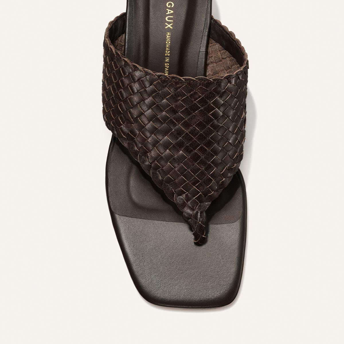 Brown woven sandal on a white background