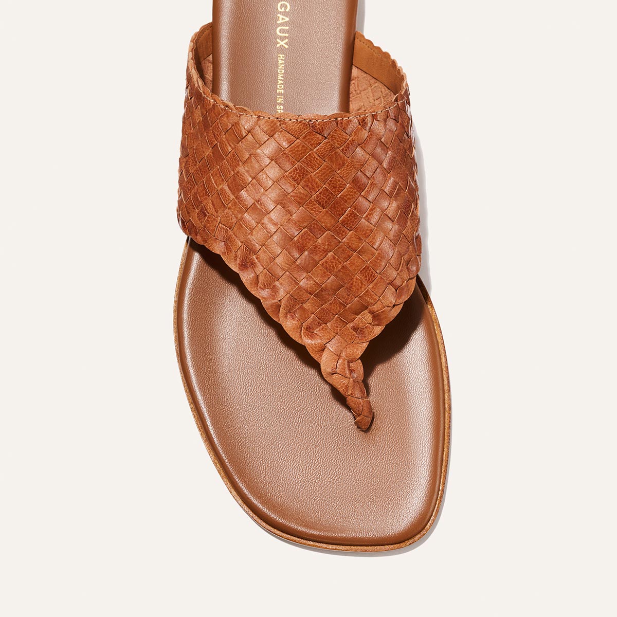 Brown woven sandal on a white background
