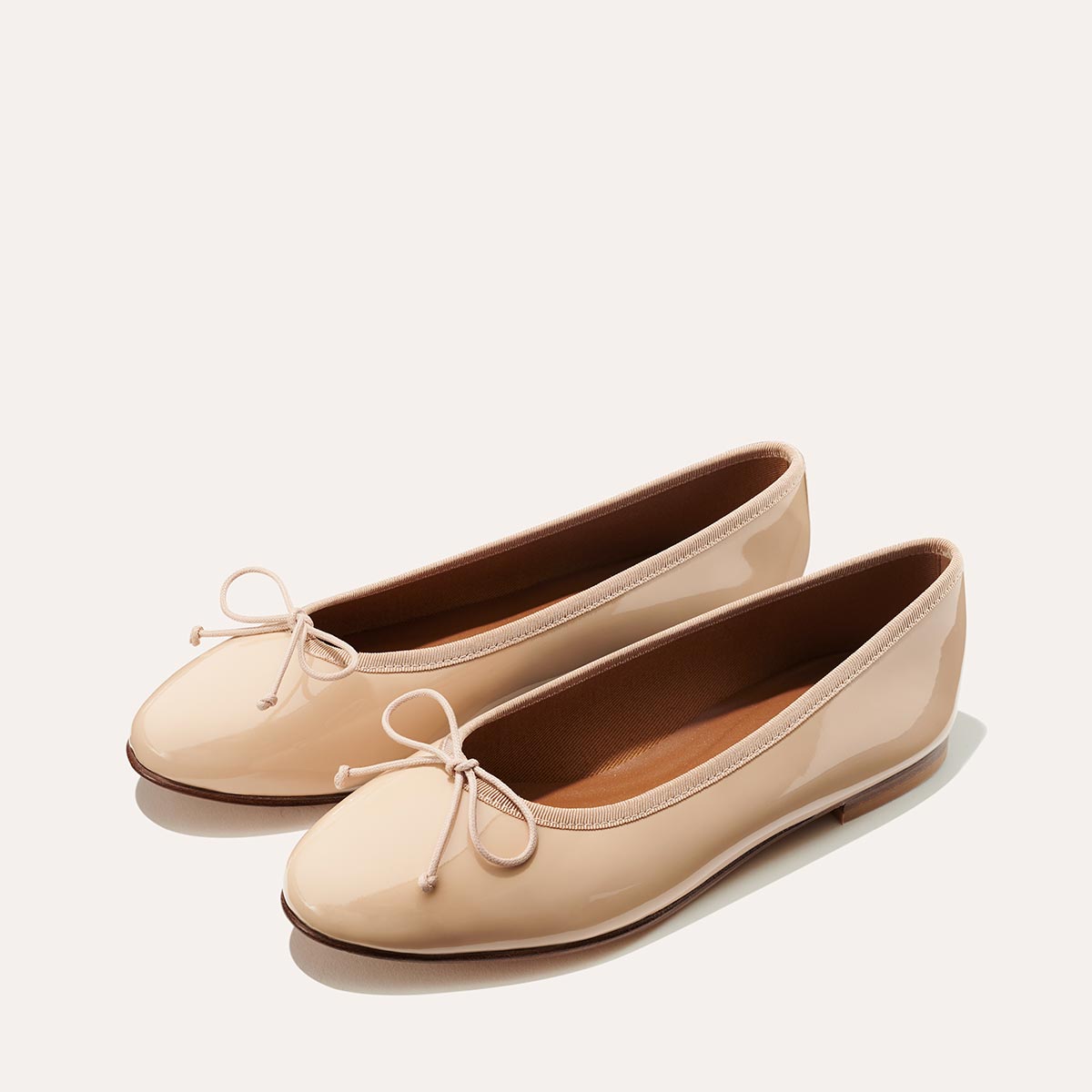 Margaux's classic and comfortable Demi ballet flat, made in a soft, blush Italian patent leather 