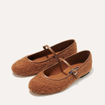 The Demi Jane in brown teddy sherpa, a ballet flat with a rounded toe and an adjustable strap for a secure fit.