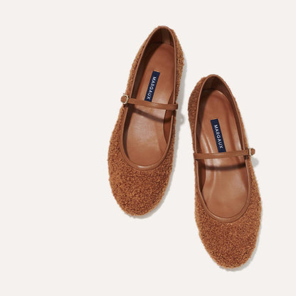 The Demi Jane in brown teddy sherpa, a ballet flat with a rounded toe and an adjustable strap for a secure fit.