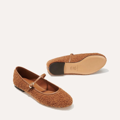 The Demi Jane in brown teddy sherpa, a ballet flat with a rounded toe and an adjustable strap for a secure fit.