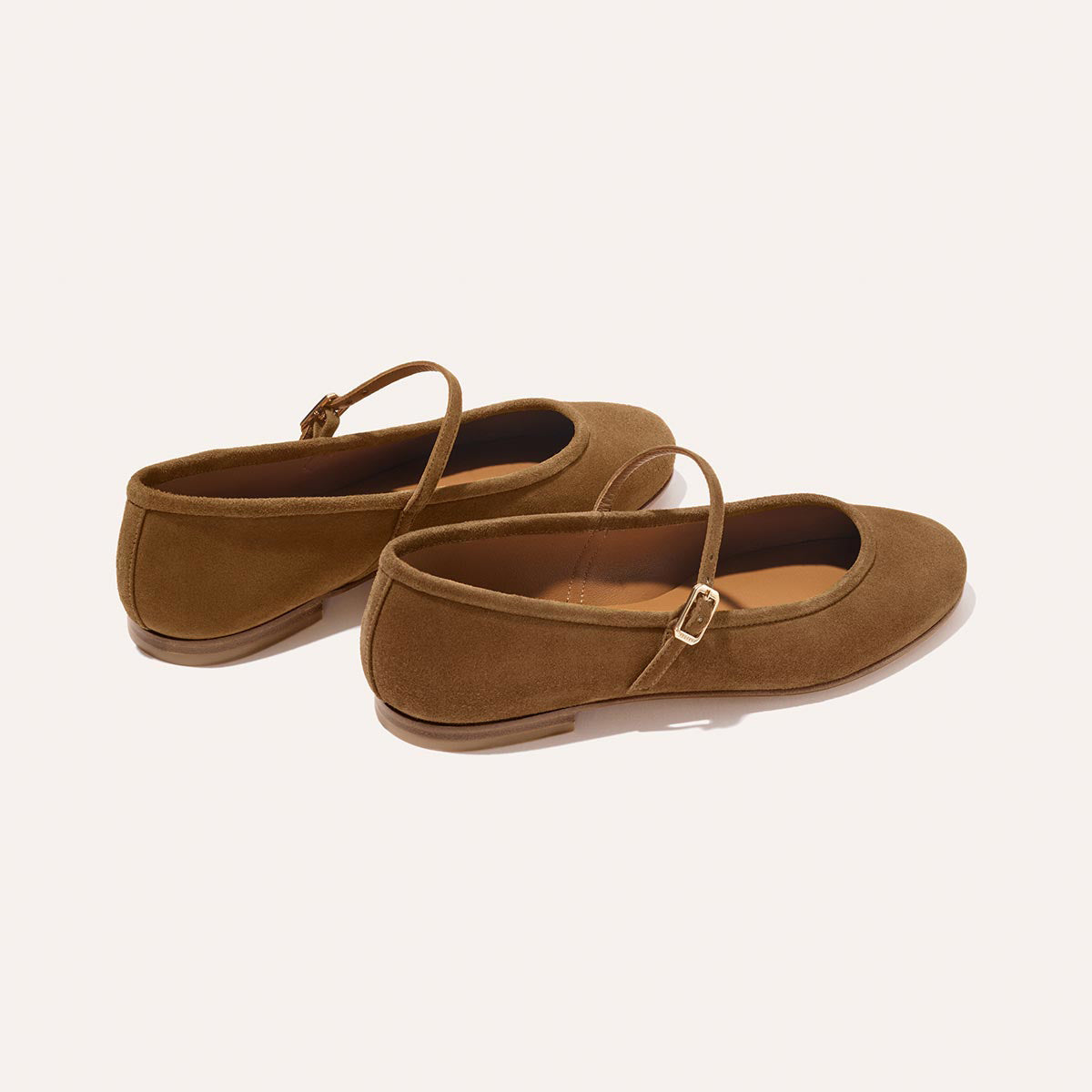 The Demi Jane - Cedar Suede by margaux-development: chic brown suede Mary Jane flats with a slim strap and subtle buckle, showcased on a light background for an elegant, feminine look.