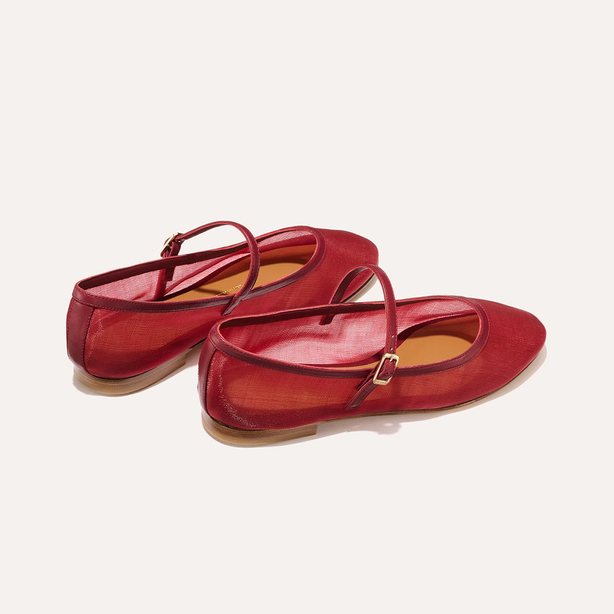 The Demi Jane in Crimson Mesh, a sheer ballet flat with a rounded toe and an adjustable strap for a secure fit.