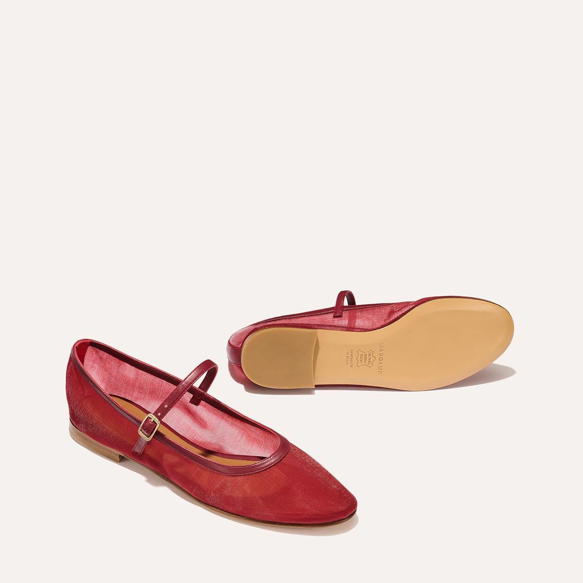 The Demi Jane in Crimson Mesh, a sheer ballet flat with a rounded toe and an adjustable strap for a secure fit.