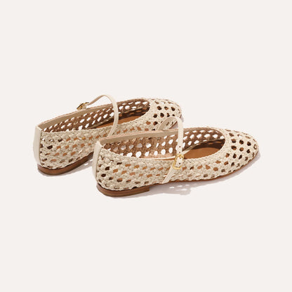 A ecru woven Mary Jane flat made from handwoven leather with a classic strap.