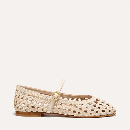 A ecru woven Mary Jane flat made from handwoven leather with a classic strap.