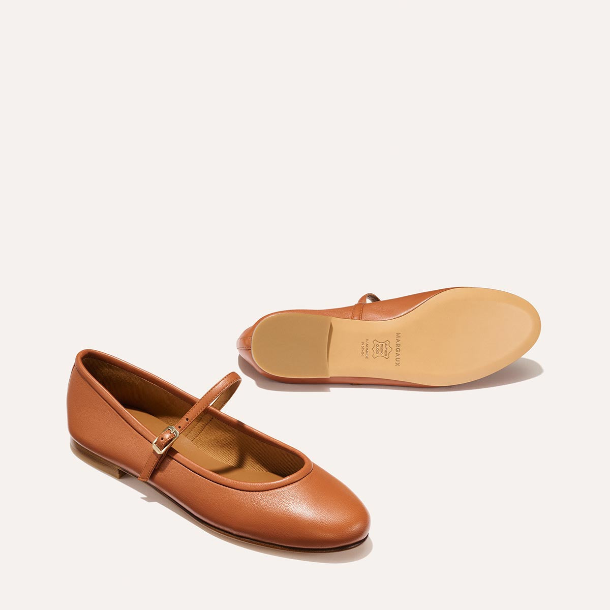 The Demi Jane in buttery soft Saddle Nappa, a ballet flat with a rounded toe and an adjustable strap for a secure fit.