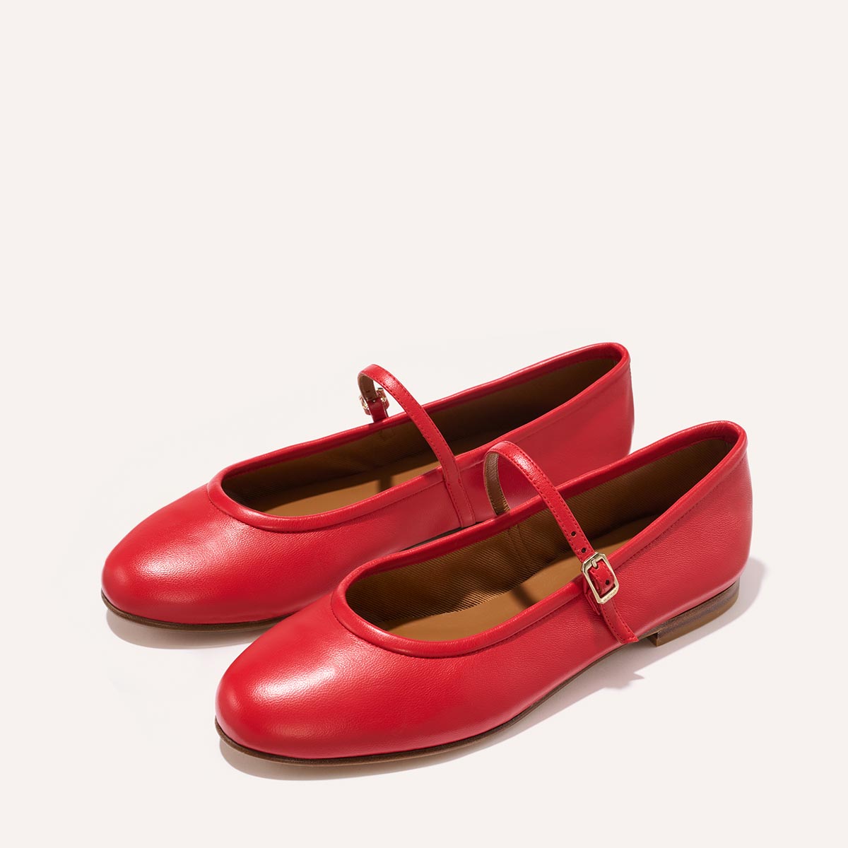 The Demi Jane in buttery soft Scarlet Nappa, a ballet flat with a rounded toe and an adjustable strap for a secure fit.