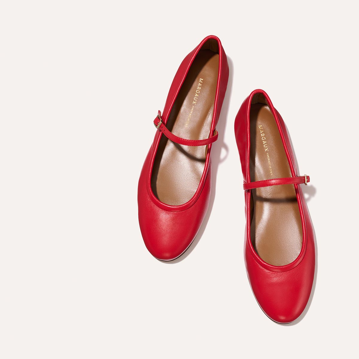 The Demi Jane in buttery soft Scarlet Nappa, a ballet flat with a rounded toe and an adjustable strap for a secure fit.